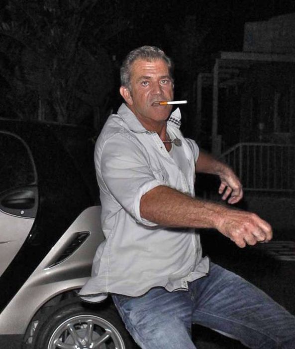 Stumbling Mel Gibson gets angry when phographed while leaving Taverna Tony restauranrt in Malibu CA